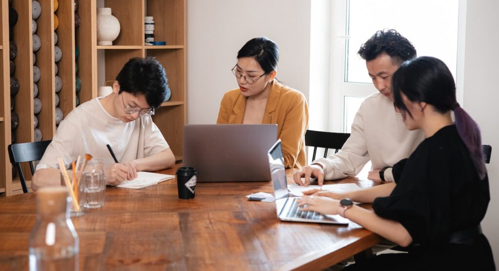 A team of agency professionals analyzing data on computer screens, showcasing the advantages of data-driven marketing strategies."