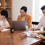 A team of agency professionals analyzing data on computer screens, showcasing the advantages of data-driven marketing strategies."