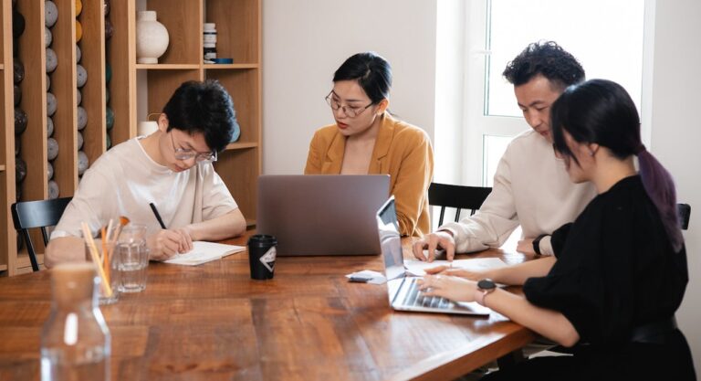 A team of agency professionals analyzing data on computer screens, showcasing the advantages of data-driven marketing strategies."